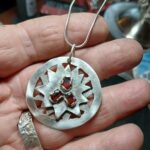 100% recycled Sterling Sun Pendant with 3 Marquis Cut Garnet
