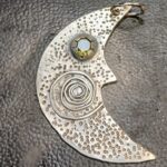 Pendant- Sterling Silver Moon with Peridot eye